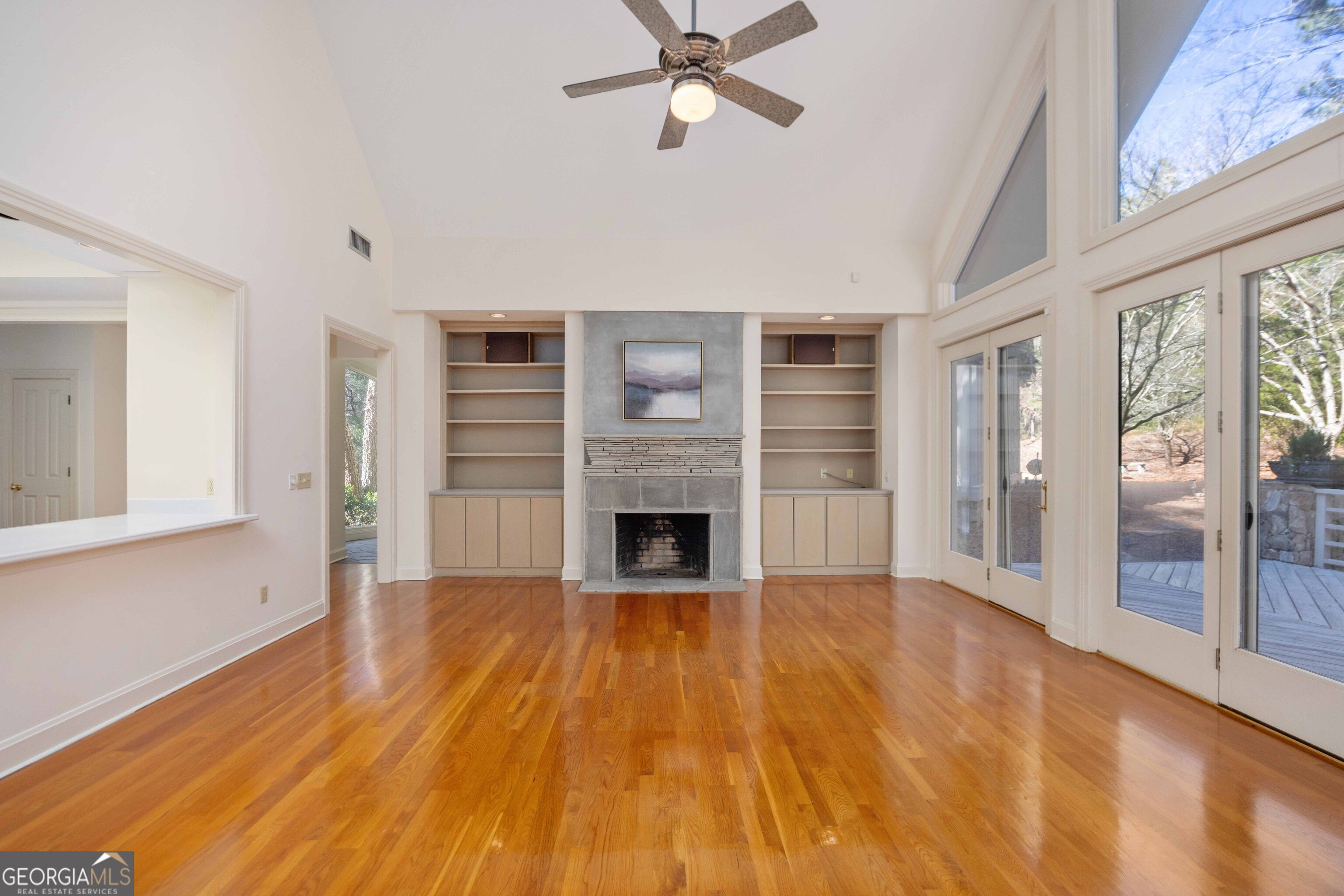 4 Mountain Ridge Court Columbus, GA 31904 - Photo 14 of 142 a view of a livingroom with a fireplace a ceiling fan and windows