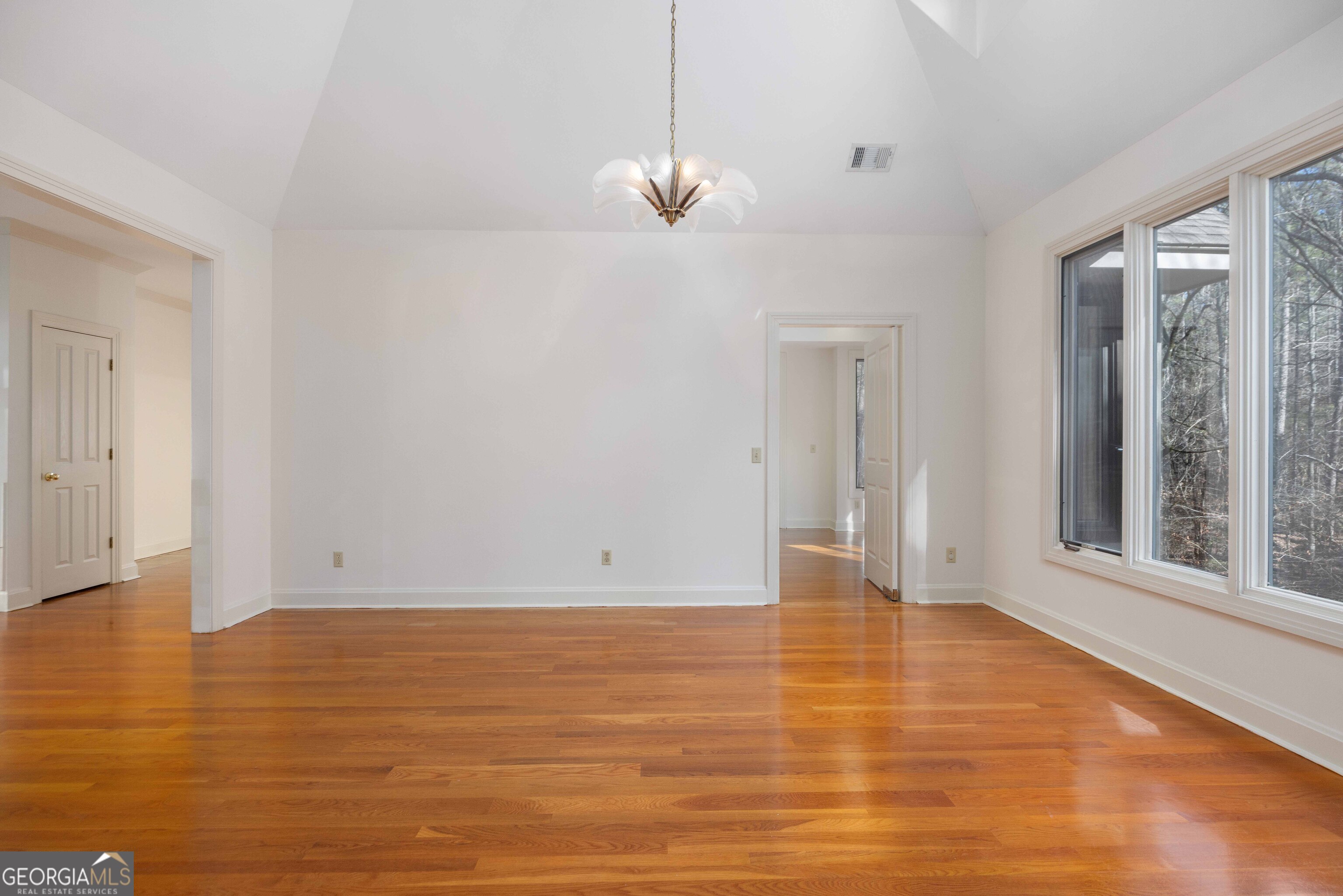 4 Mountain Ridge Court Columbus, GA 31904 - Photo 22 of 74 a view of an empty room with glass door and wooden floor