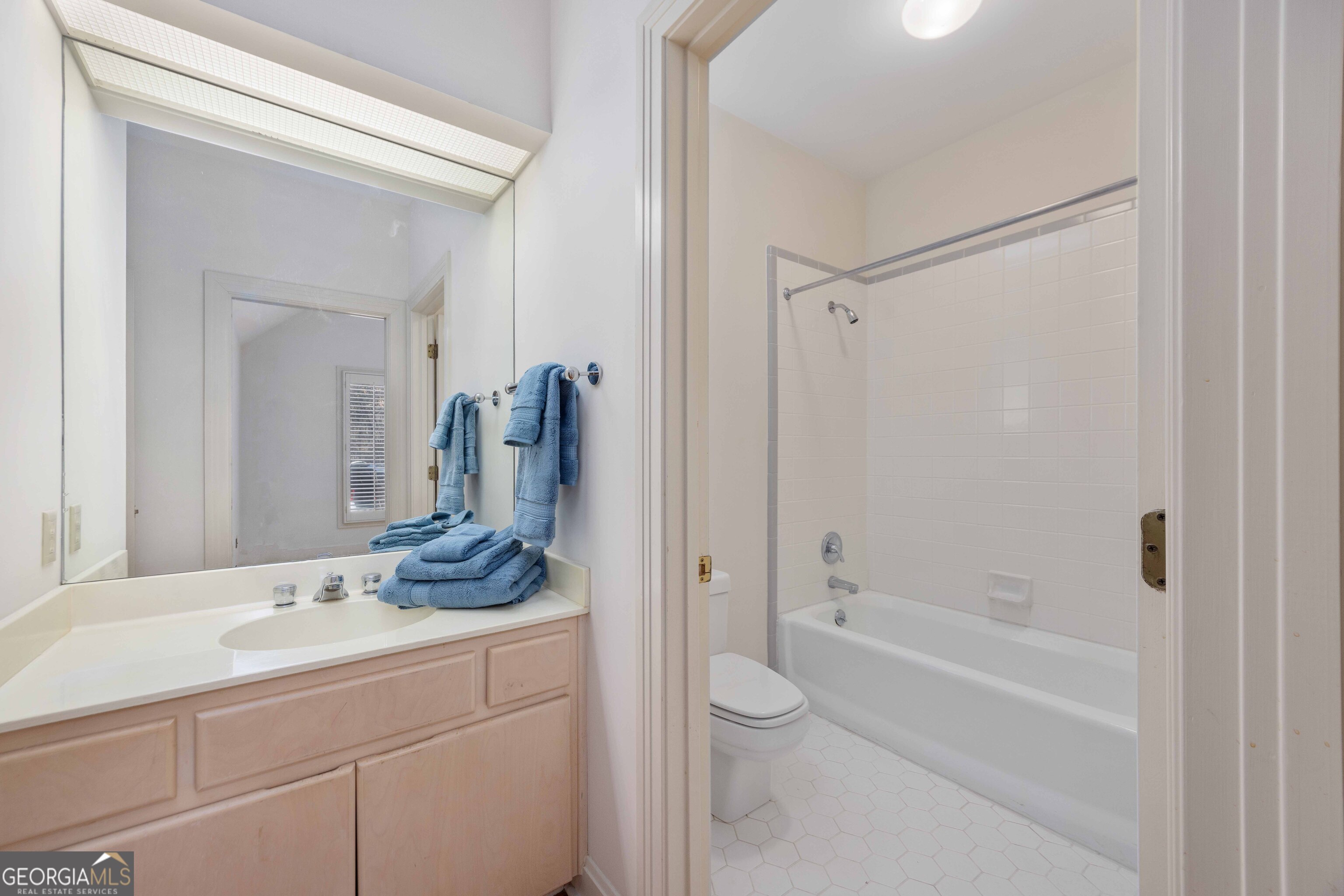 4 Mountain Ridge Court Columbus, GA 31904 - Photo 38 of 74 a bathroom with a granite countertop sink a toilet and shower