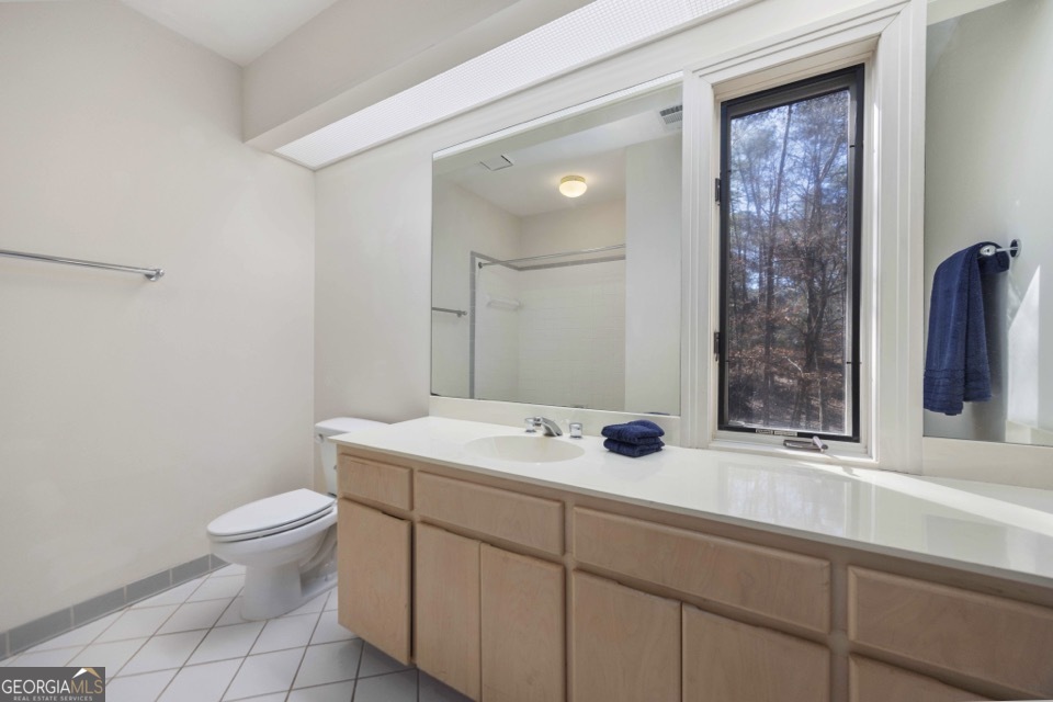4 Mountain Ridge Court Columbus, GA 31904 - Photo 42 of 74 a bathroom with a sink a toilet and a mirror