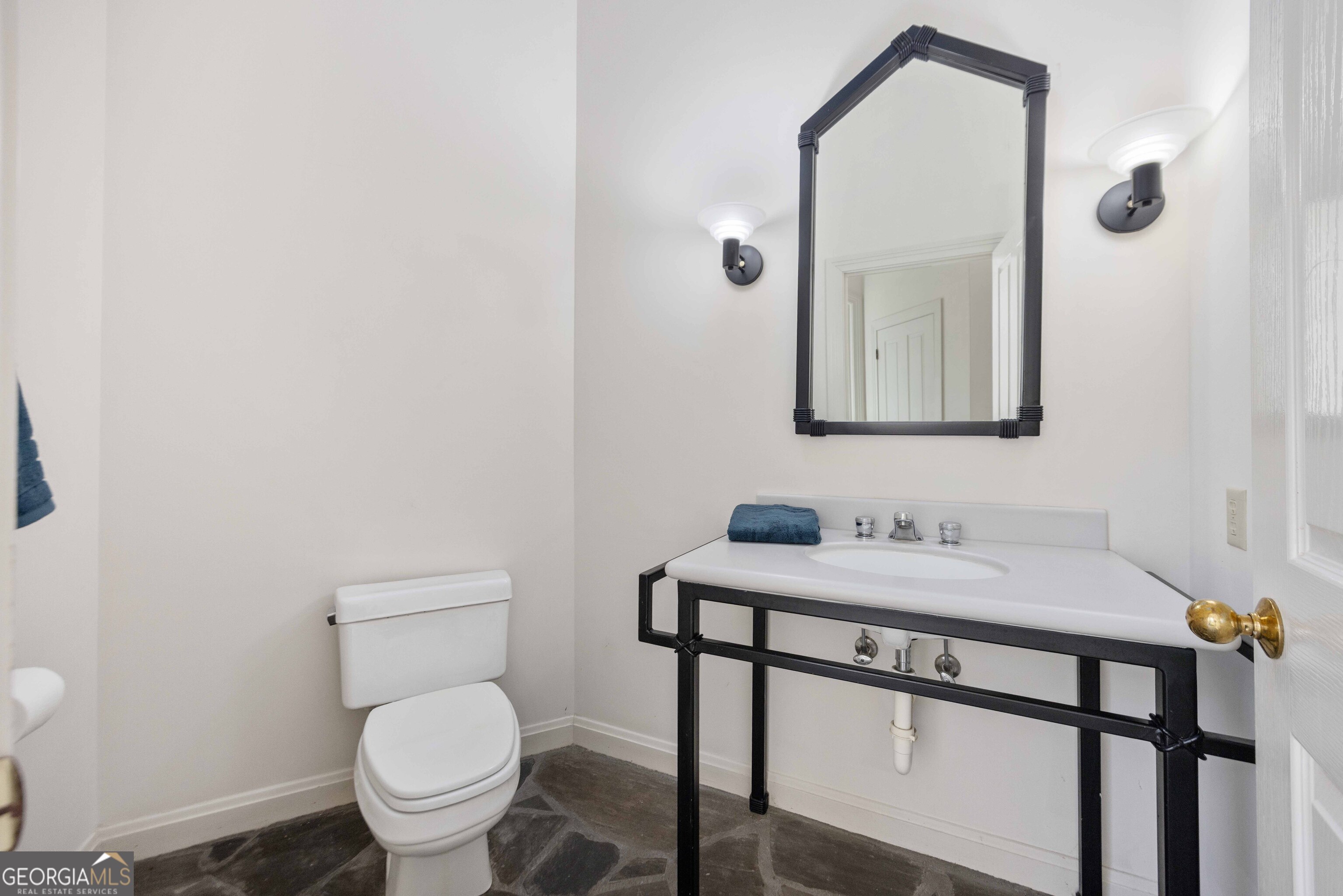 4 Mountain Ridge Court Columbus, GA 31904 - Photo 45 of 74 a bathroom with a toilet sink and mirror