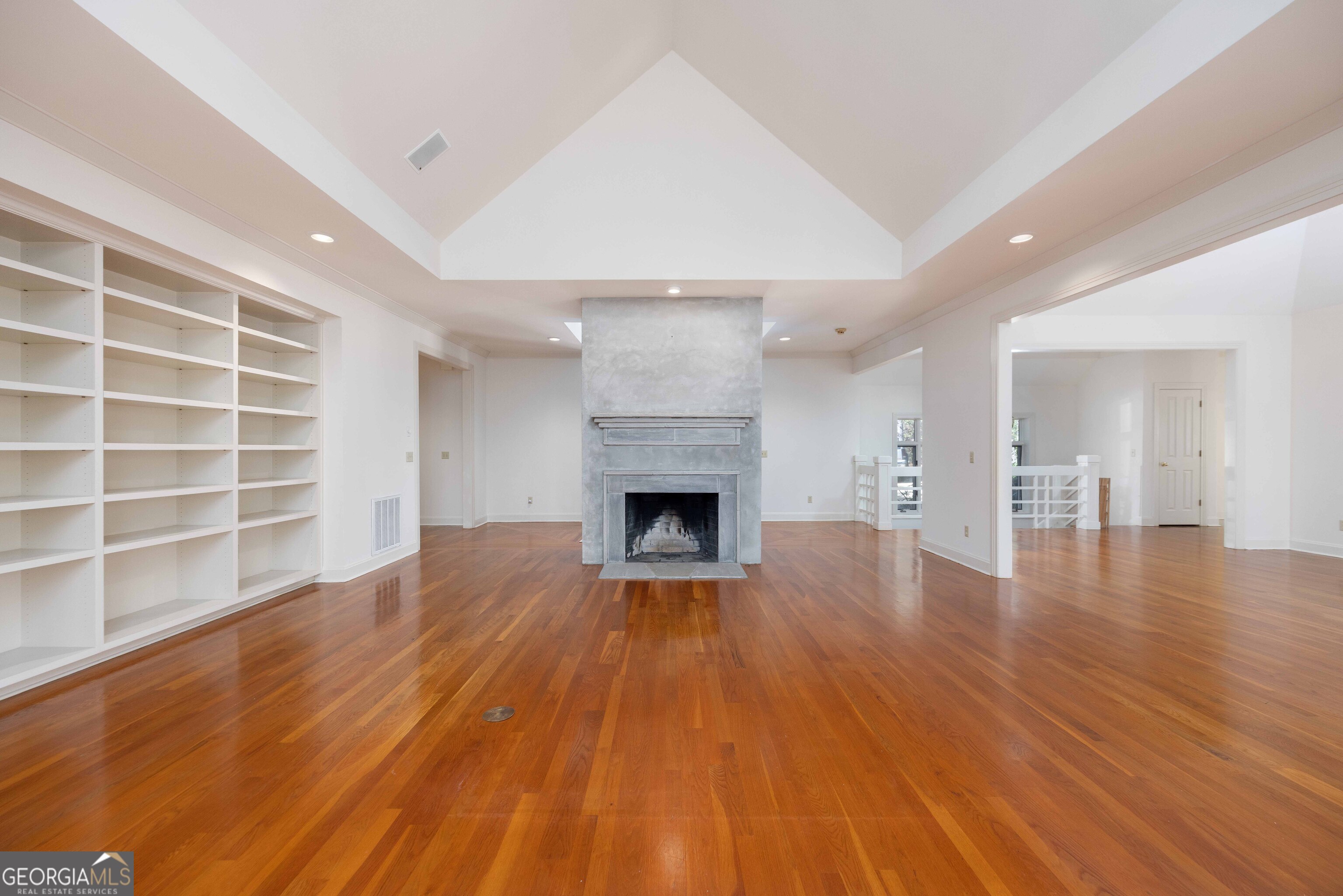 4 Mountain Ridge Court Columbus, GA 31904 - Photo 5 of 74 a view of a livingroom with wooden floor and a fireplace