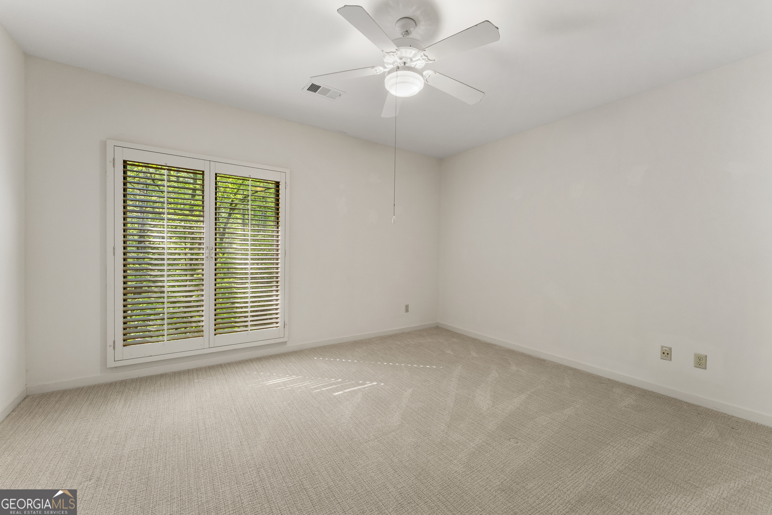 4 Mountain Ridge Court Columbus, GA 31904 - Photo 81 of 142 an empty room with a window and a ceiling fan