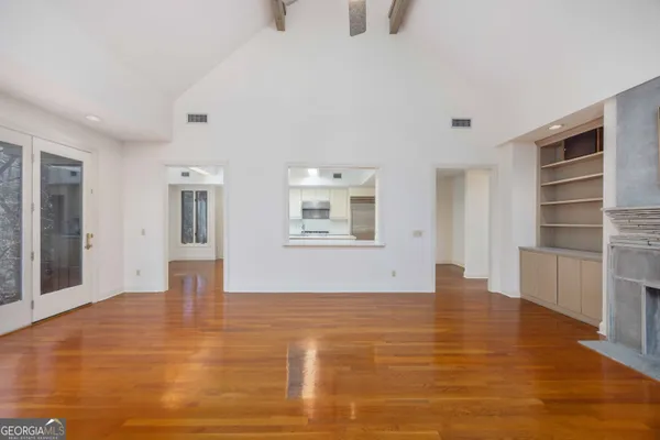 a view of an entryway with wooden floor