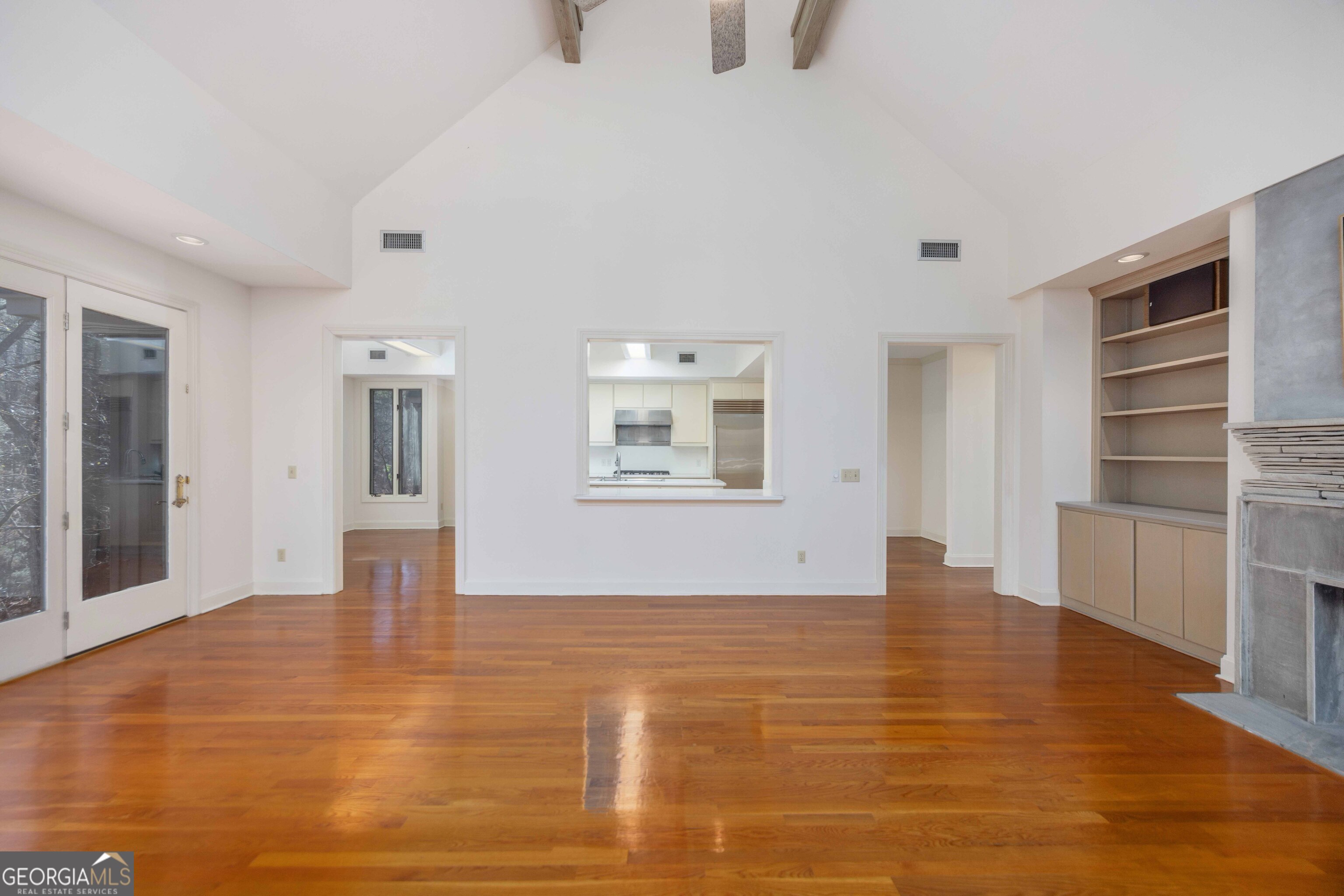 4 Mountain Ridge Court Columbus, GA 31904 - Photo 10 of 74 a view of an empty room with a window and wooden floor