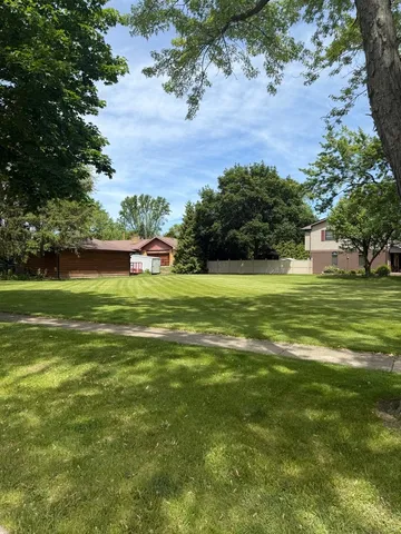 a backyard of a house with lots of green space