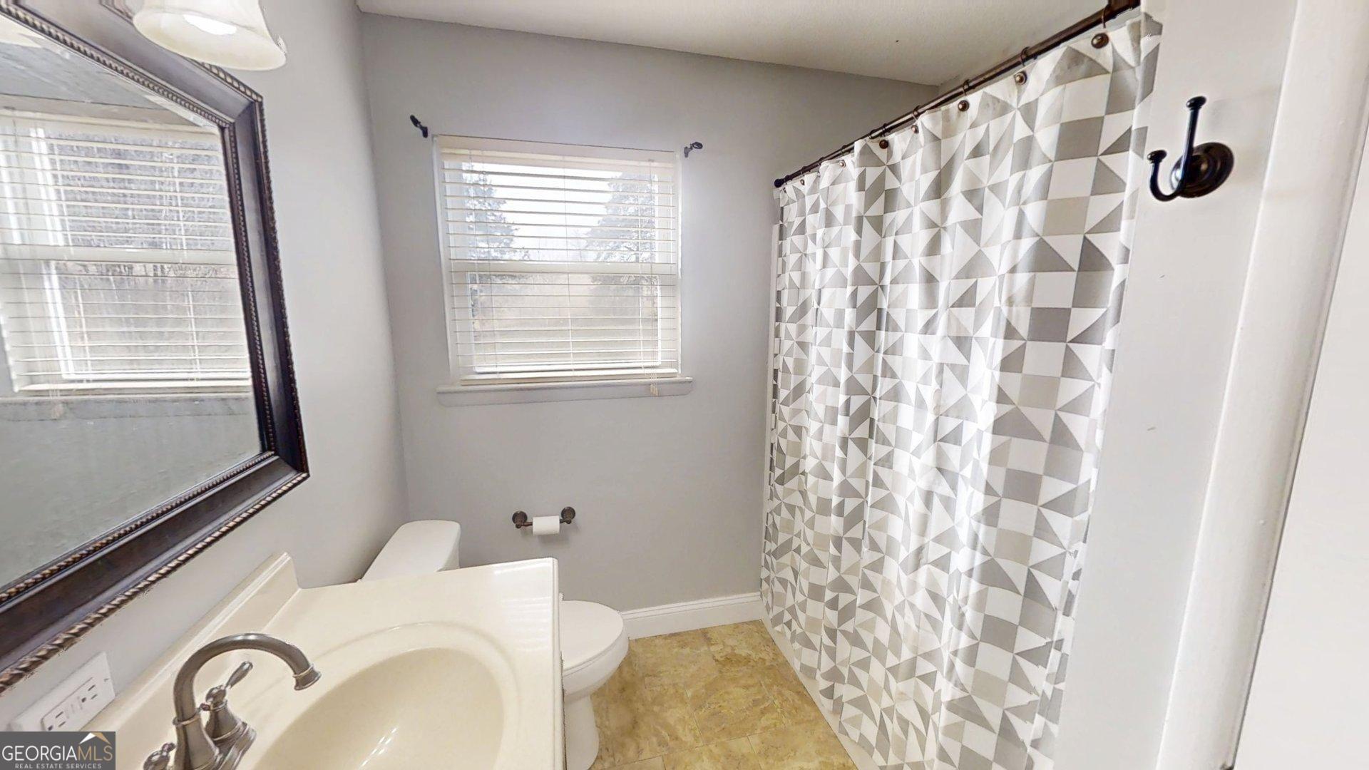 906 Diamond Circle LaFayette, GA 30728 - Photo 11 of 26 a bathroom with a sink toilet and shower