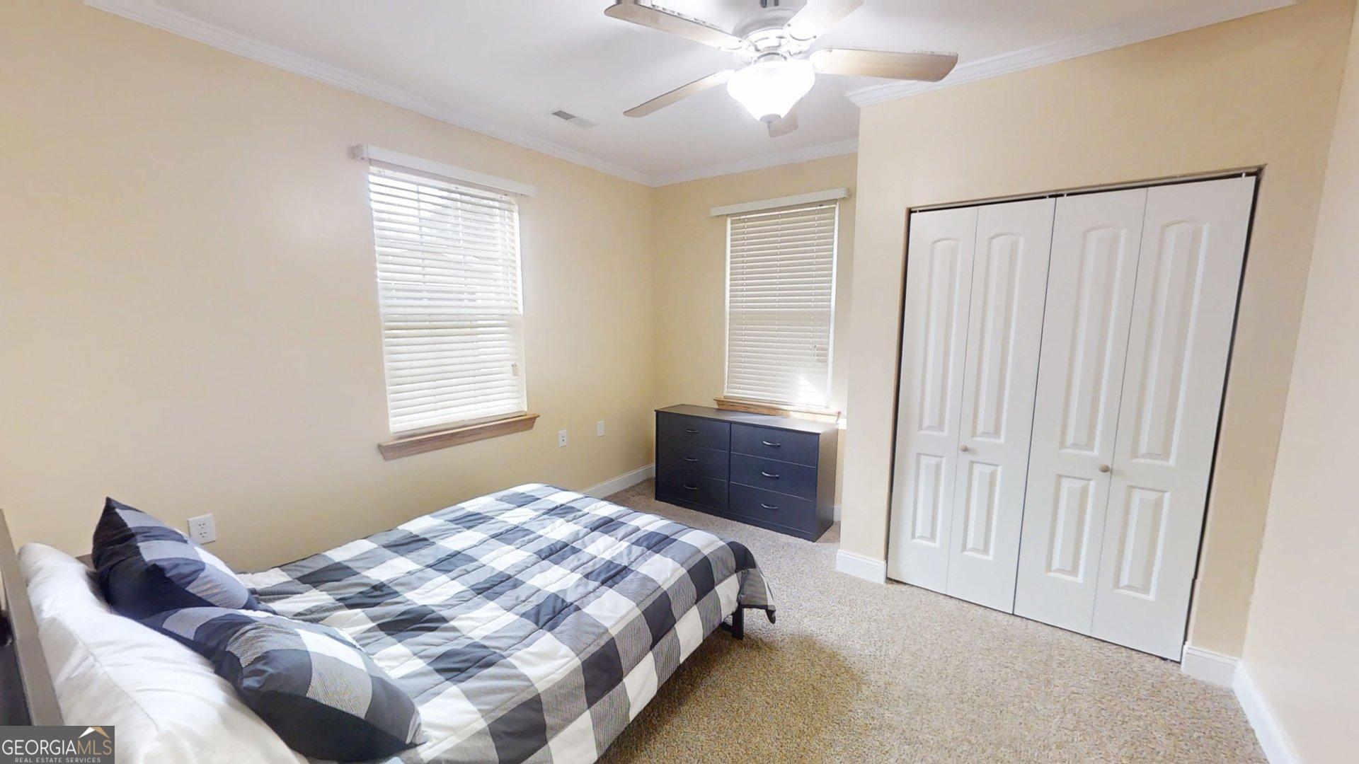 906 Diamond Circle LaFayette, GA 30728 - Photo 19 of 26 a bedroom with a bed and a window