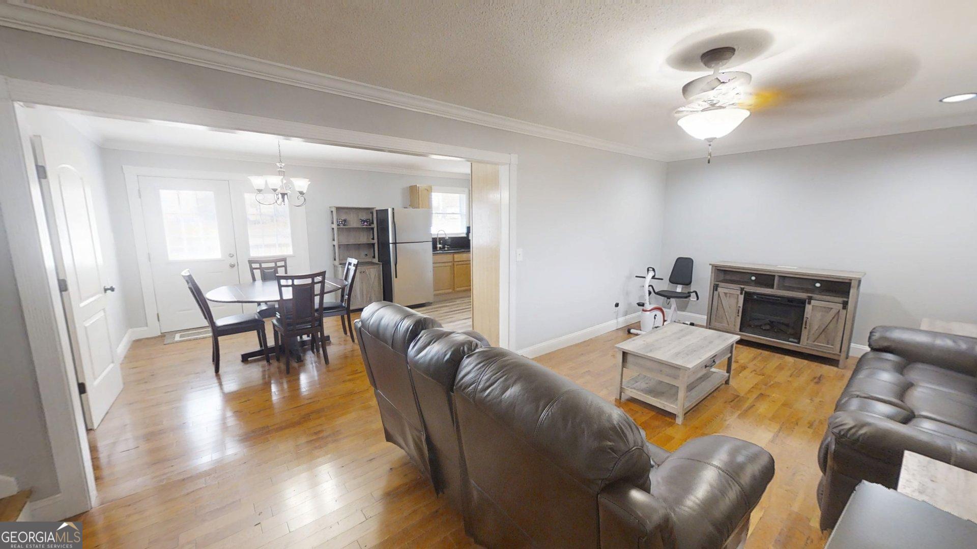 906 Diamond Circle LaFayette, GA 30728 - Photo 5 of 26 a living room with furniture and a wooden floor