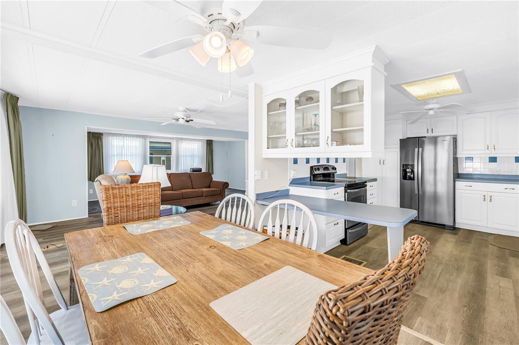 1100 South Belcher Road, Unit 502 Largo, FL 33771 - Photo 6 of 51 a living room with furniture and a chandelier