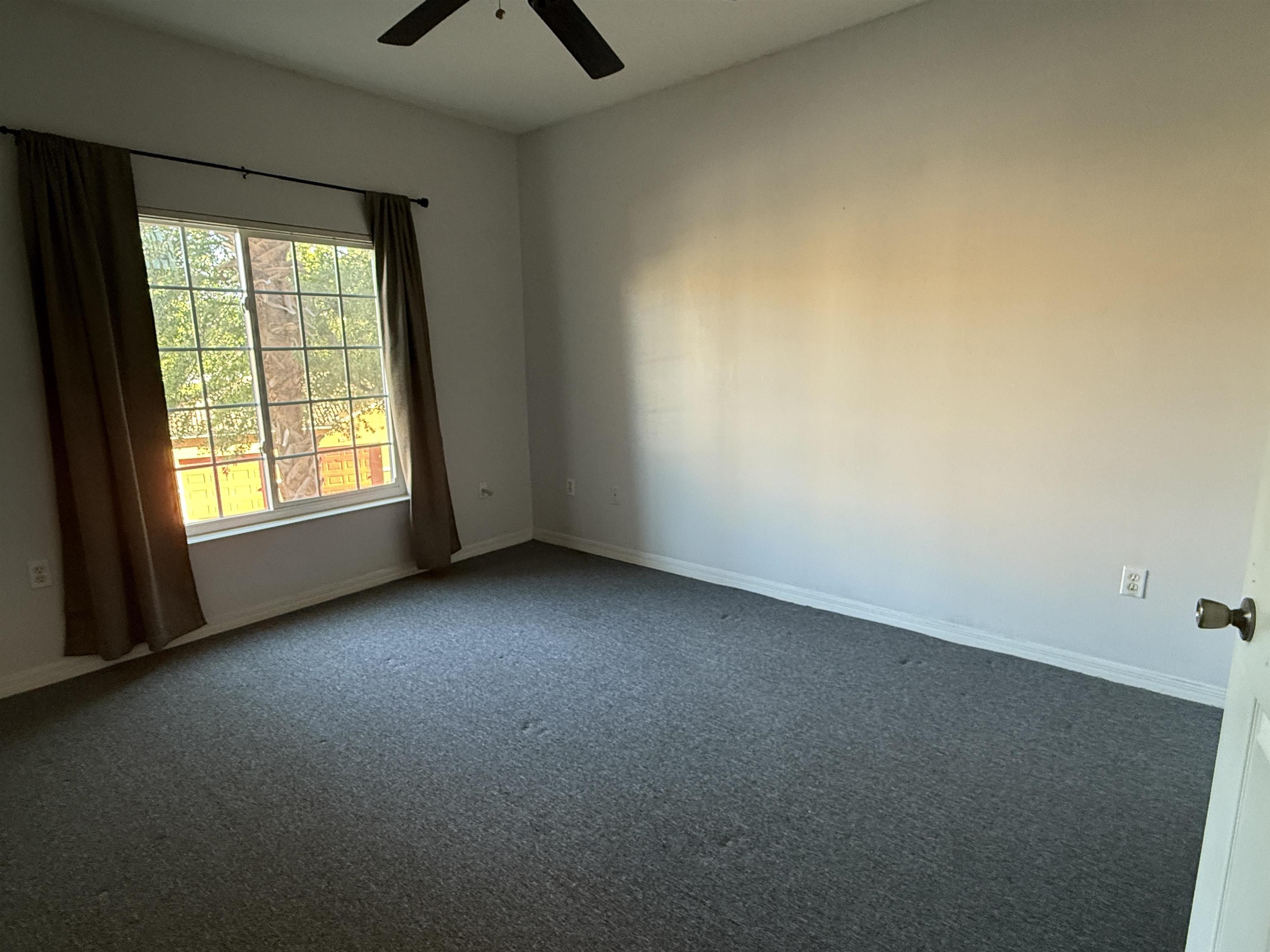 550 Florida Club Boulevard, Unit 205 St. Augustine, FL 32084 - Photo 9 of 10 an empty room with a window and a kitchen