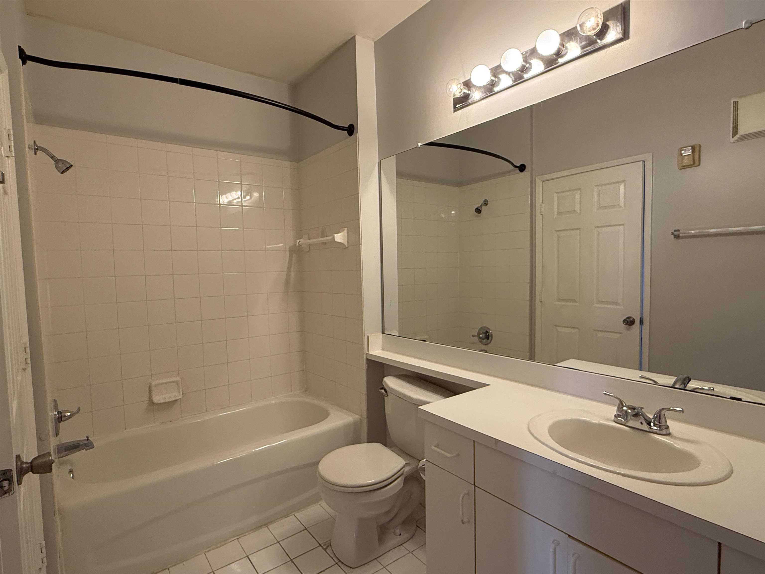 550 Florida Club Boulevard, Unit 205 St. Augustine, FL 32084 - Photo 10 of 10 a bathroom with a sink toilet a mirror and shower