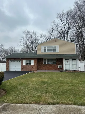 a view of a building with a yard