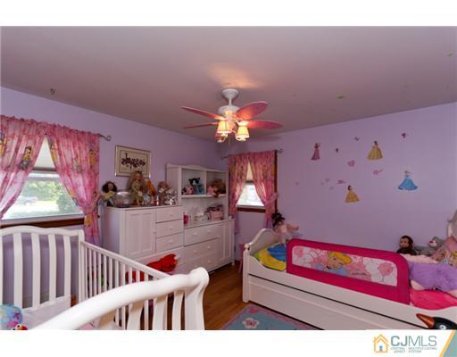 107 Main Street Middlesex, NJ 08846 - Photo 3 of 15 a living room with furniture and a chandelier