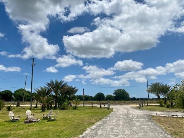 3025 Matthews Road Fort Pierce, FL 34945 - Photo 12 of 35 a view of swimming pool and lake in the back