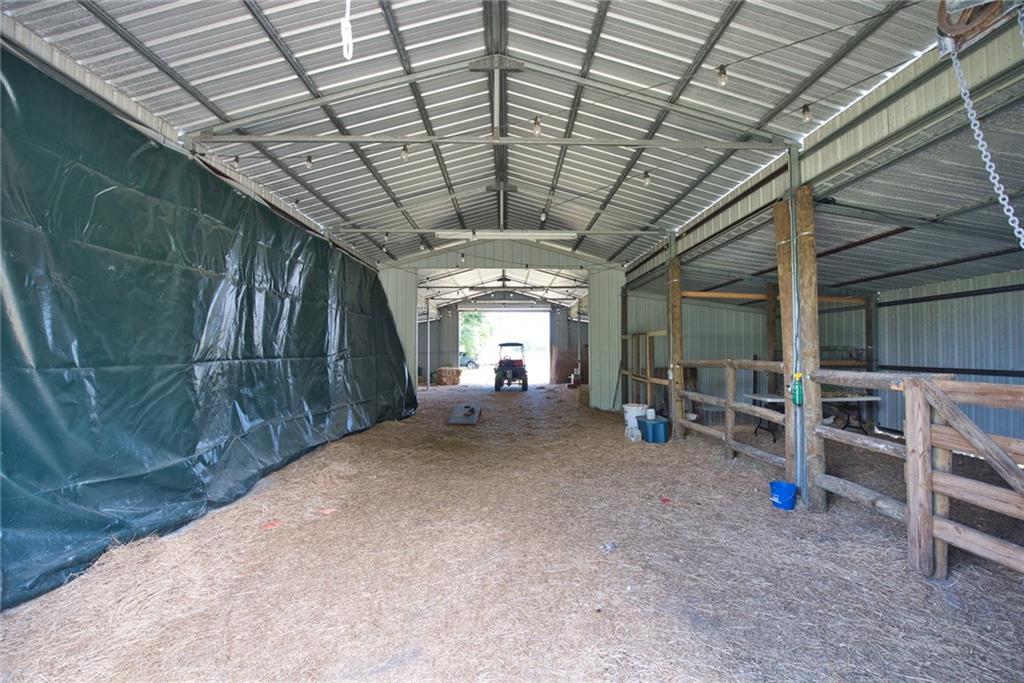 3025 Matthews Road Fort Pierce, FL 34945 - Photo 16 of 35 a view of a hallway with wooden roof and stairs