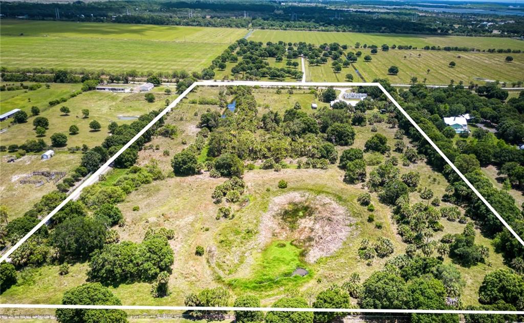 3025 Matthews Road Fort Pierce, FL 34945 - Photo 24 of 35 a view of a swimming pool and a yard