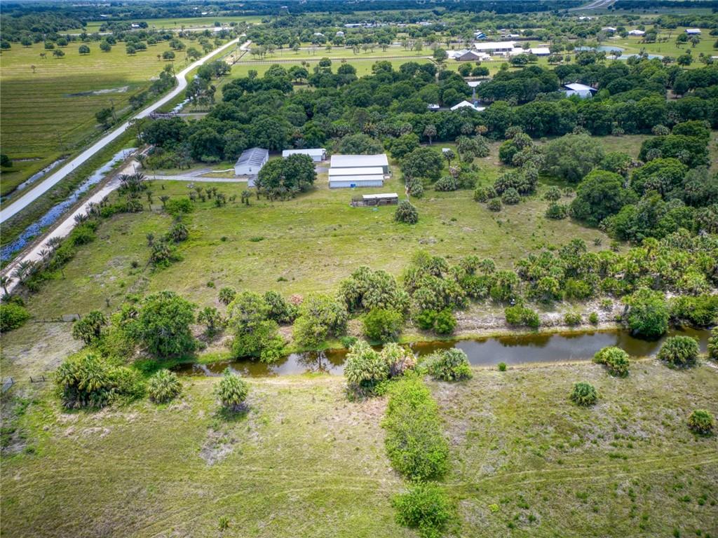3025 Matthews Road Fort Pierce, FL 34945 - Photo 29 of 35 a view of a lake with a yard