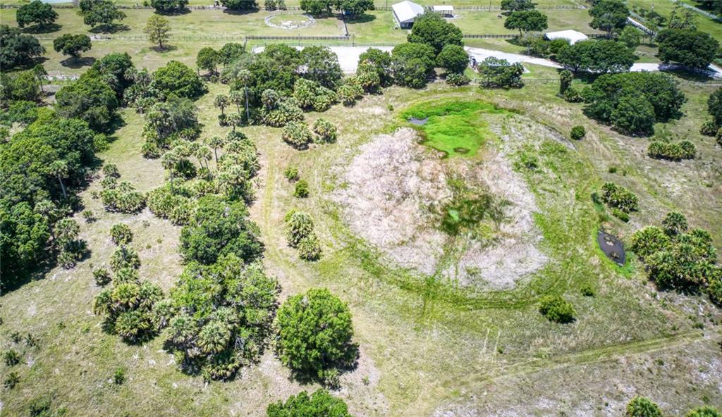 3025 Matthews Road Fort Pierce, FL 34945 - Photo 30 of 35 a view of a garden with a fountain