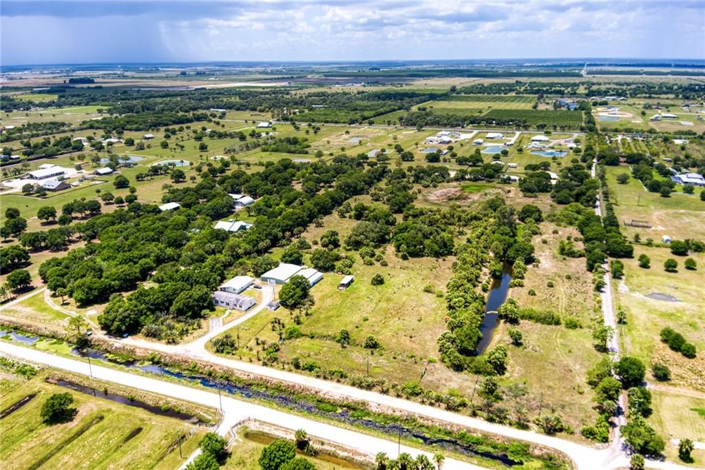 3025 Matthews Road Fort Pierce, FL 34945 - Photo 7 of 35 a view of a yard with an outdoor space