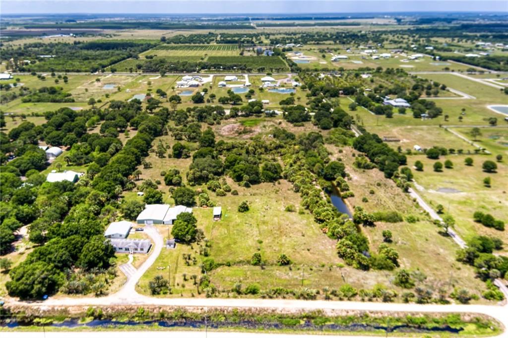 3025 Matthews Road Fort Pierce, FL 34945 - Photo 10 of 35 a view of a yard with an outdoor space