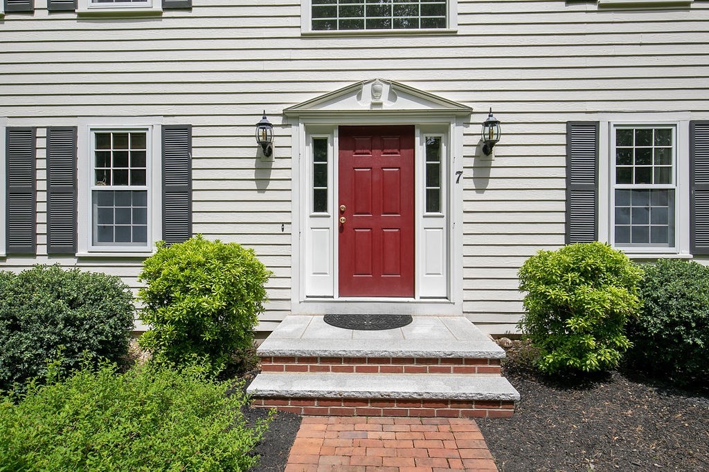 7 Old Bare Hill Road Boxford, MA 01921 - Photo 3 of 42 a front view of a house with plants
