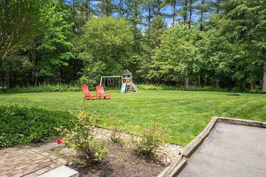 7 Old Bare Hill Road Boxford, MA 01921 - Photo 5 of 42 a backyard of a house with table and chairs