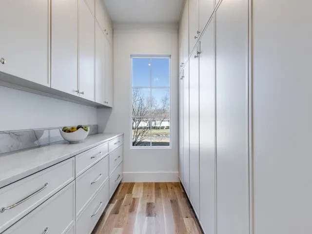 a kitchen with granite countertop cabinets and stainless steel appliances