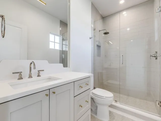 a kitchen with a stove and a refrigerator