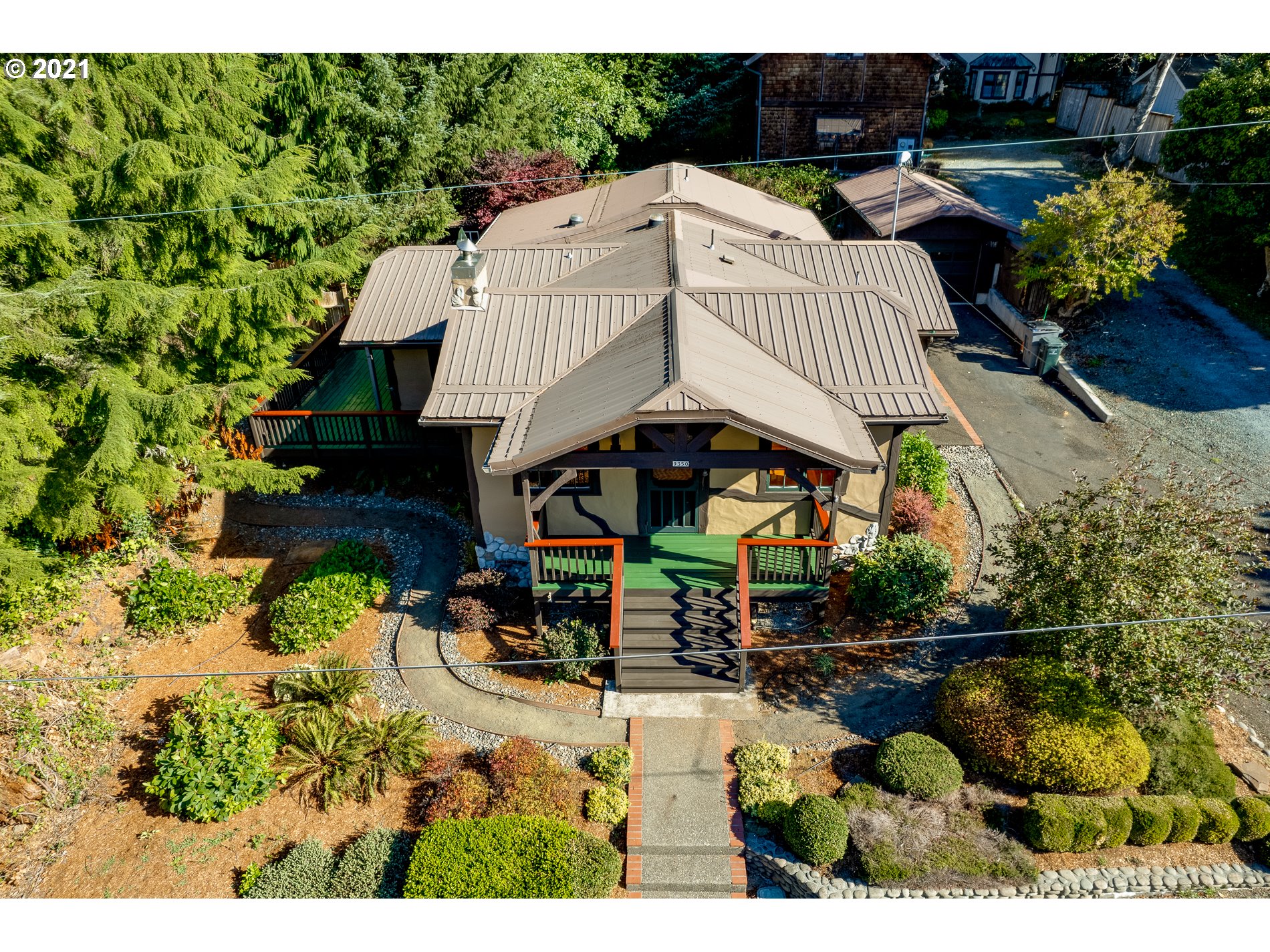9350 Nehalem Road Nehalem, OR 97131 - Photo 6 of 31 a view of a patio with table and chairs and potted plants