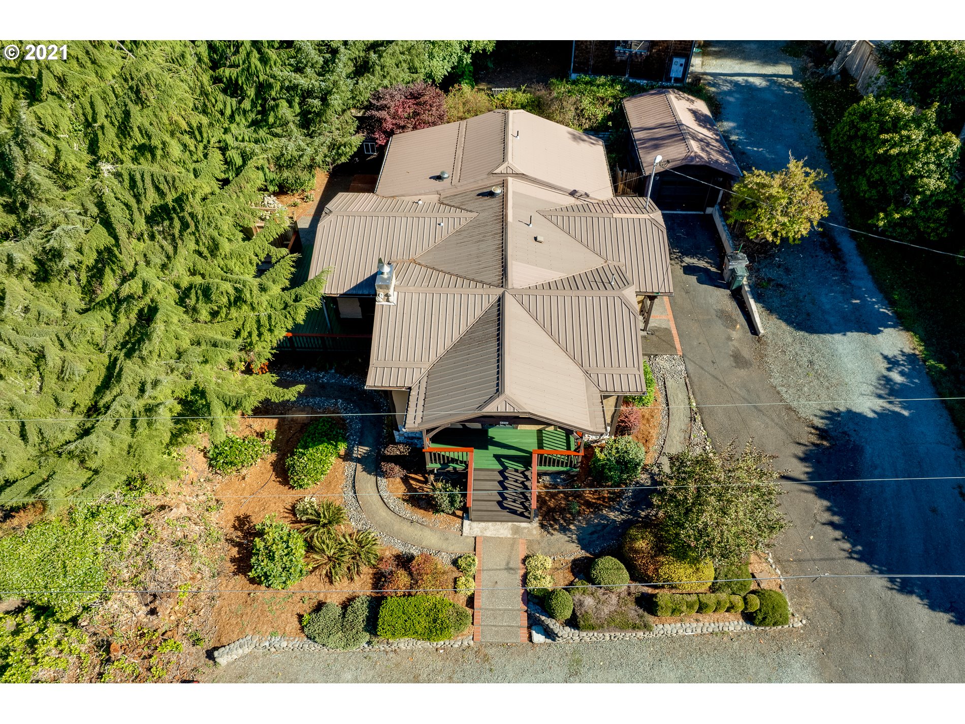 9350 Nehalem Road Nehalem, OR 97131 - Photo 7 of 31 an aerial view of a house with a yard and garden