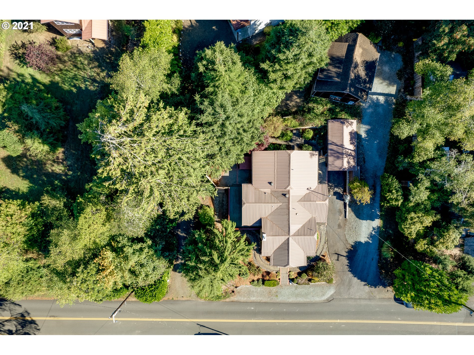9350 Nehalem Road Nehalem, OR 97131 - Photo 10 of 31 an aerial view of residential houses with outdoor space and trees