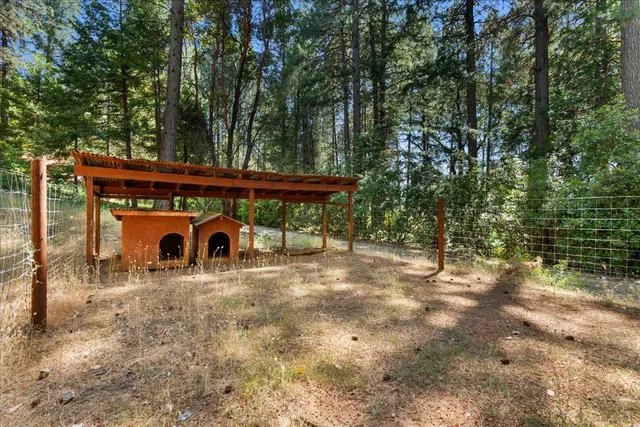 a view of a chairs and table under an umbrella