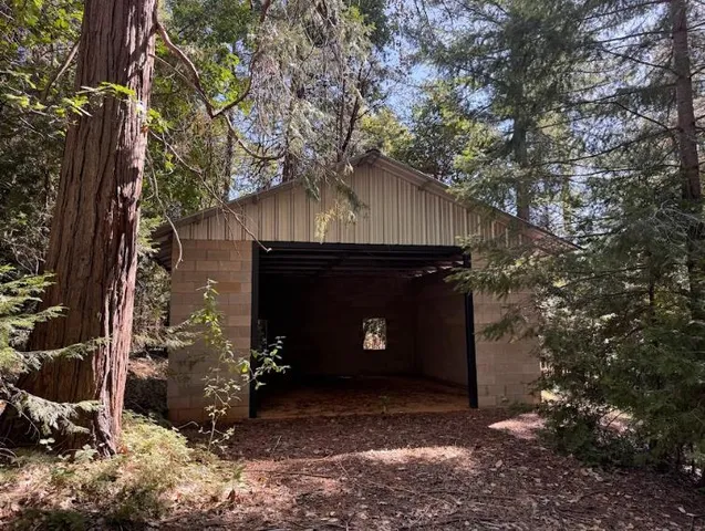 a view of a door of the house and a yard