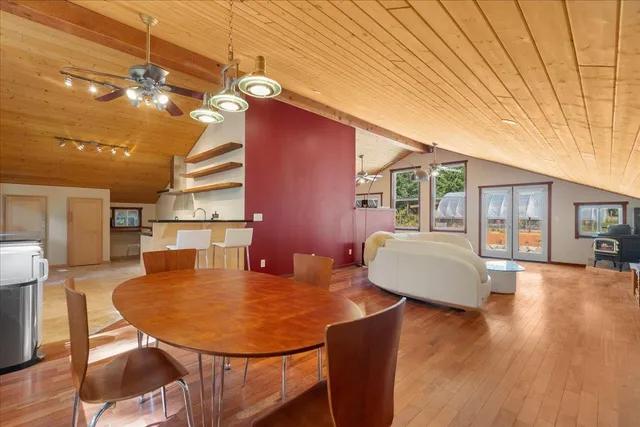 a balcony with table and chairs