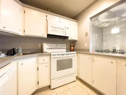 a kitchen with a table and chairs in it