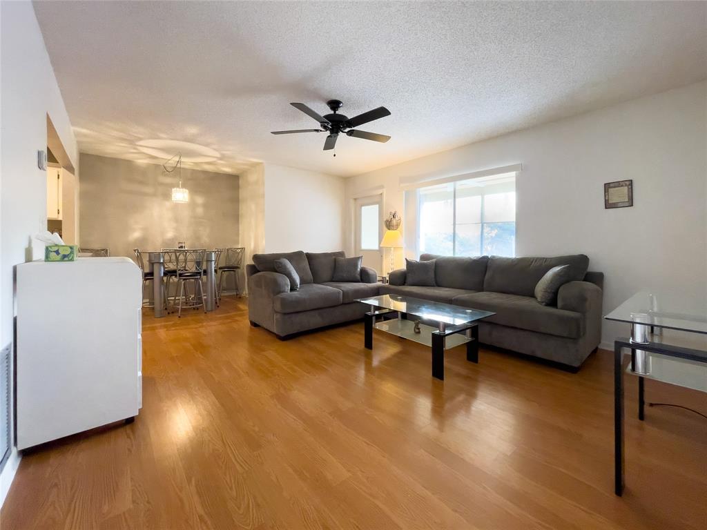 317 Knotty Pine Circle, Unit C2 Greenacres, FL 33463 - Photo 18 of 51 a living room with furniture and a wooden floor