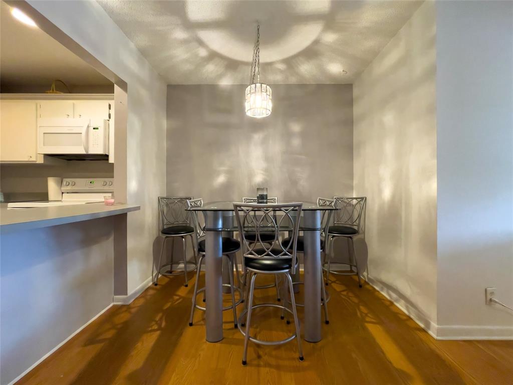 317 Knotty Pine Circle, Unit C2 Greenacres, FL 33463 - Photo 22 of 51 a view of a dining room with furniture and a chandelier