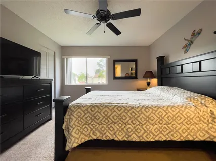 a bedroom with a bed and window