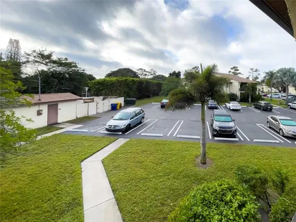 a view of a swimming pool with a yard