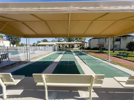 a view of a swimming pool with a patio