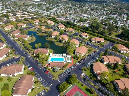 an aerial view of residential building with parking space