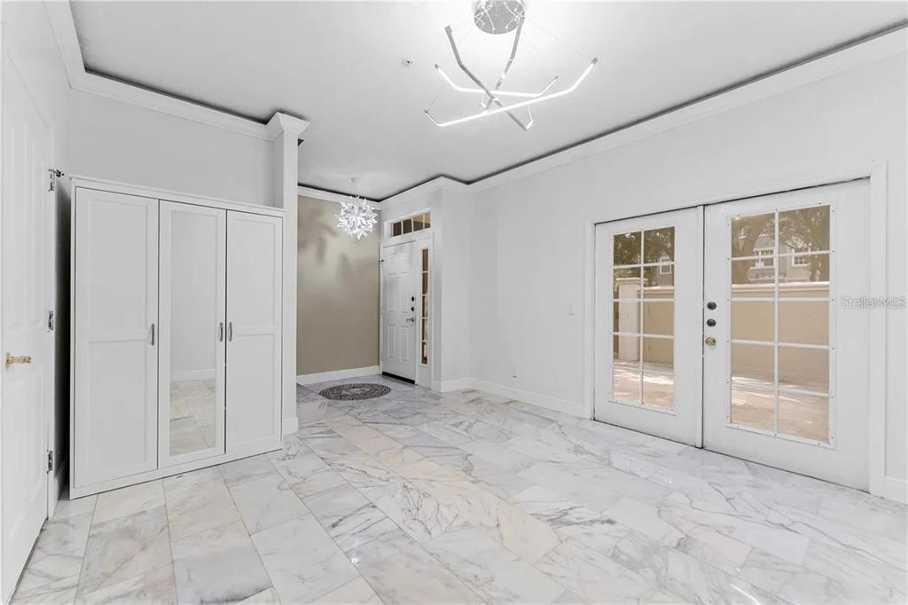 1437 Harbour Walk Road Tampa, FL 33602 - Photo 23 of 32 an empty room with windows and closet