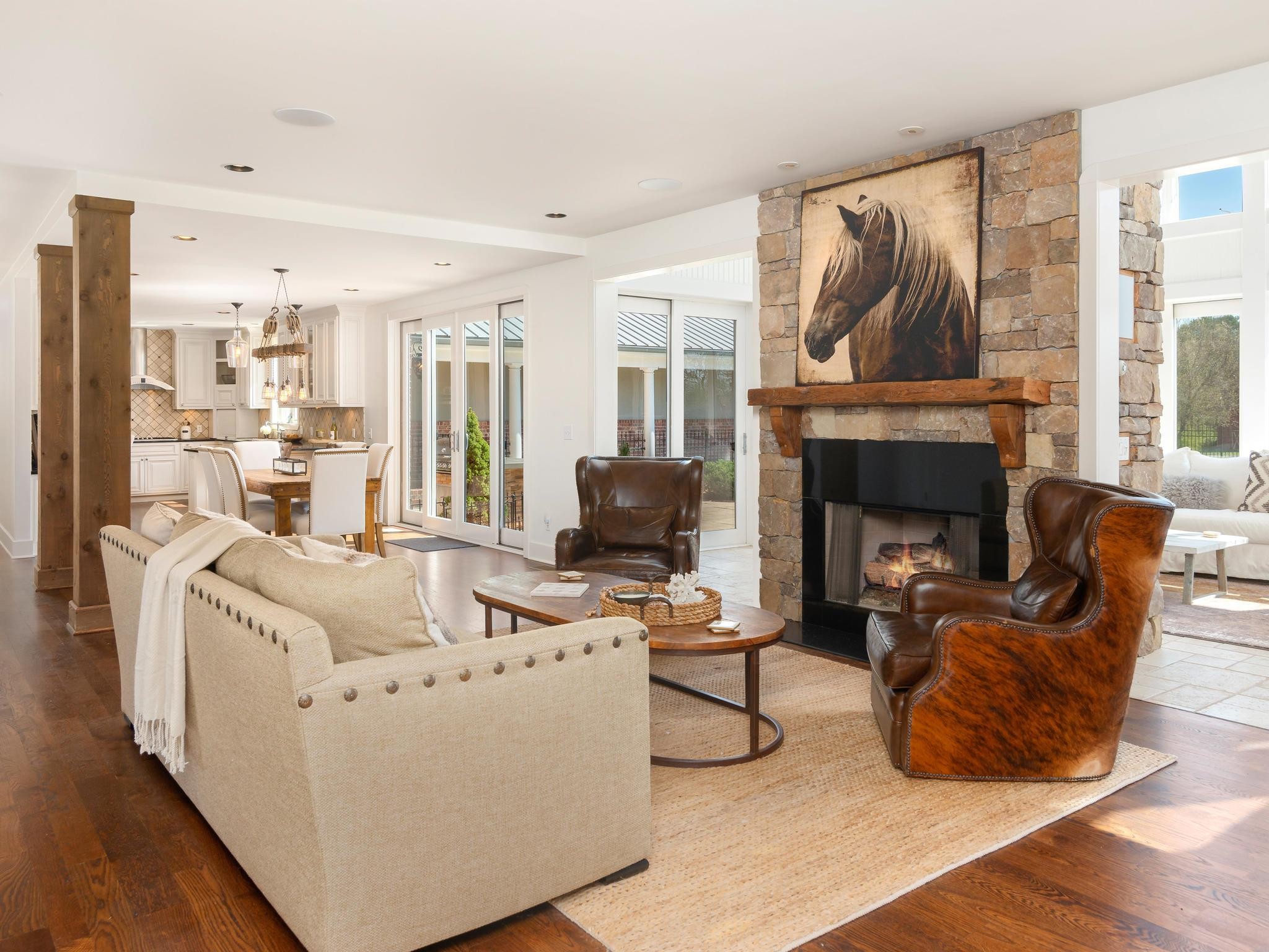1539 Old Hillsboro Road Franklin, TN 37069 - Photo 11 of 38 a living room with furniture a fireplace and a floor to ceiling window
