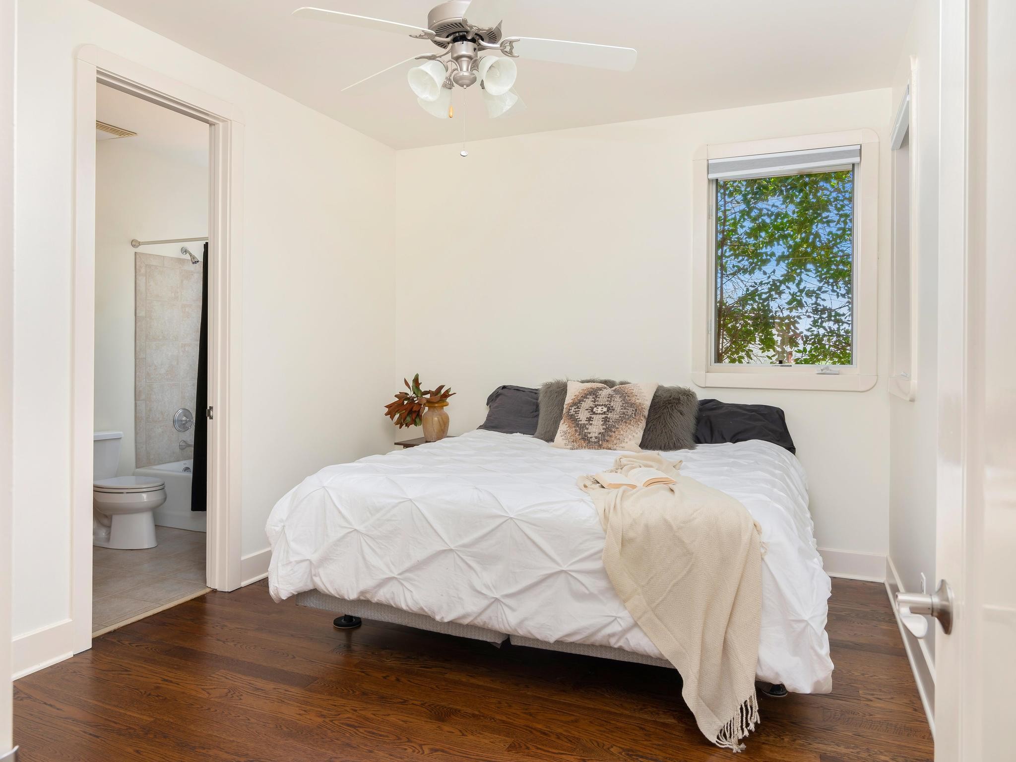 1539 Old Hillsboro Road Franklin, TN 37069 - Photo 23 of 38 a bedroom with a bed and a chandelier