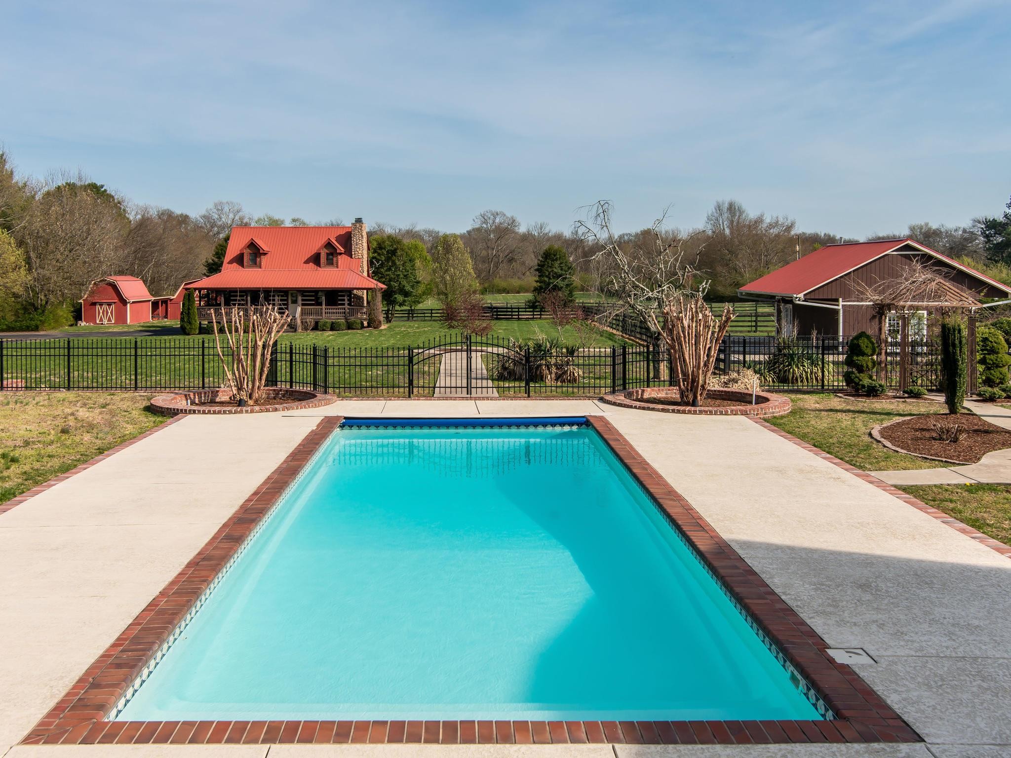1539 Old Hillsboro Road Franklin, TN 37069 - Photo 31 of 38 a swimming pool view with a seating space and a garden