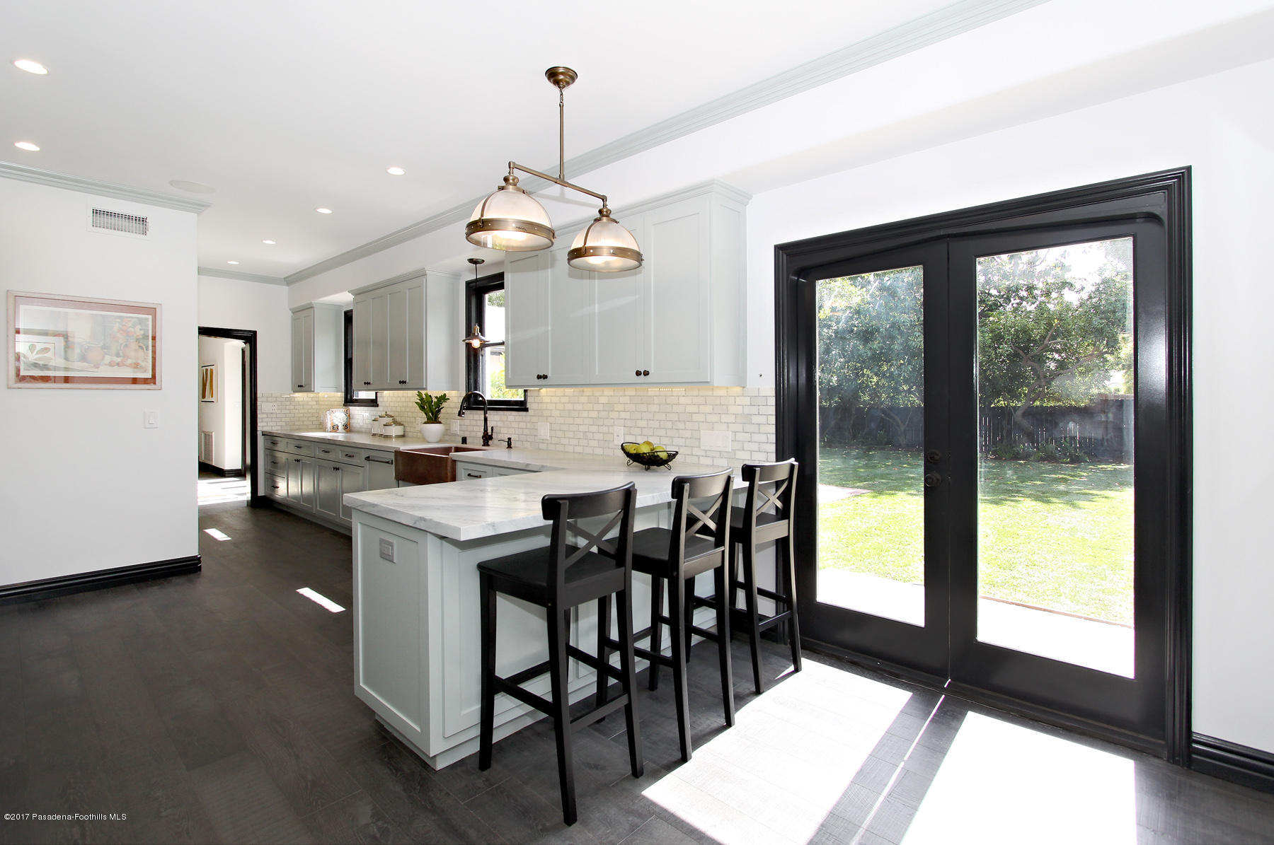 1415 Parkview Avenue Pasadena, CA 91103 - Photo 14 of 35 a view of a dining room and livingroom with furniture wooden floor a chandelier