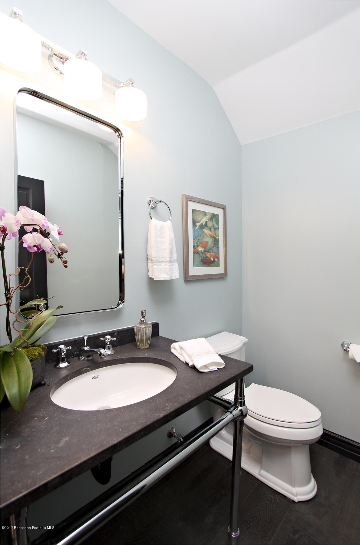 1415 Parkview Avenue Pasadena, CA 91103 - Photo 15 of 35 a bathroom with a granite countertop sink a toilet and a mirror