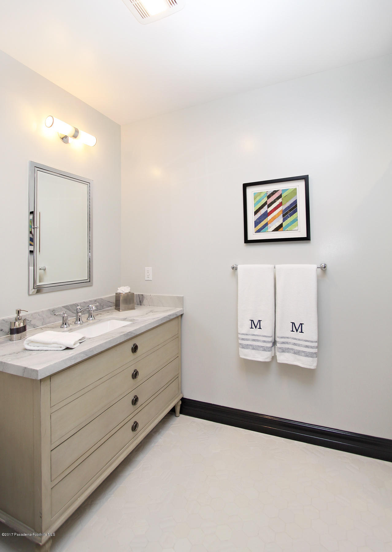 1415 Parkview Avenue Pasadena, CA 91103 - Photo 17 of 35 a bathroom with a double vanity sink and a mirror