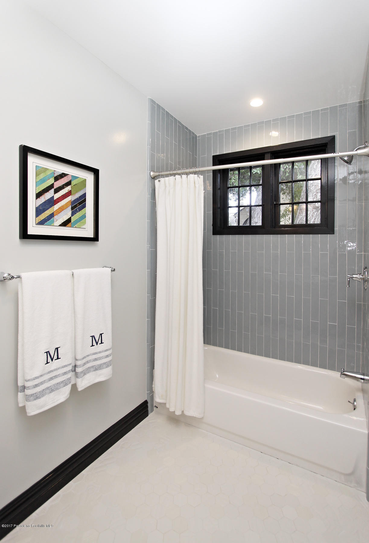 1415 Parkview Avenue Pasadena, CA 91103 - Photo 18 of 35 a bathroom with a bathtub and a window